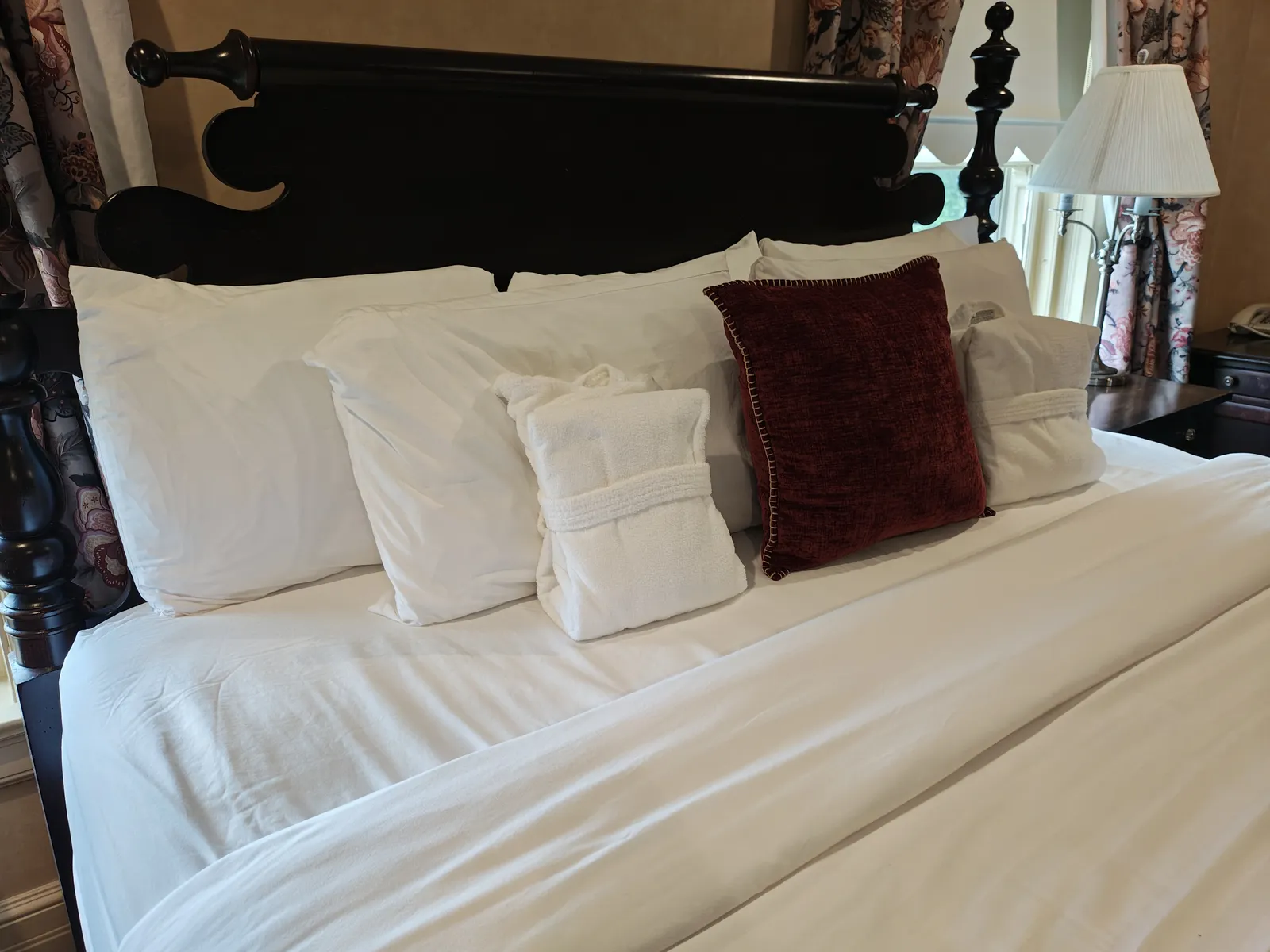 Eisenhower Suite pillows and folded robes on the bed